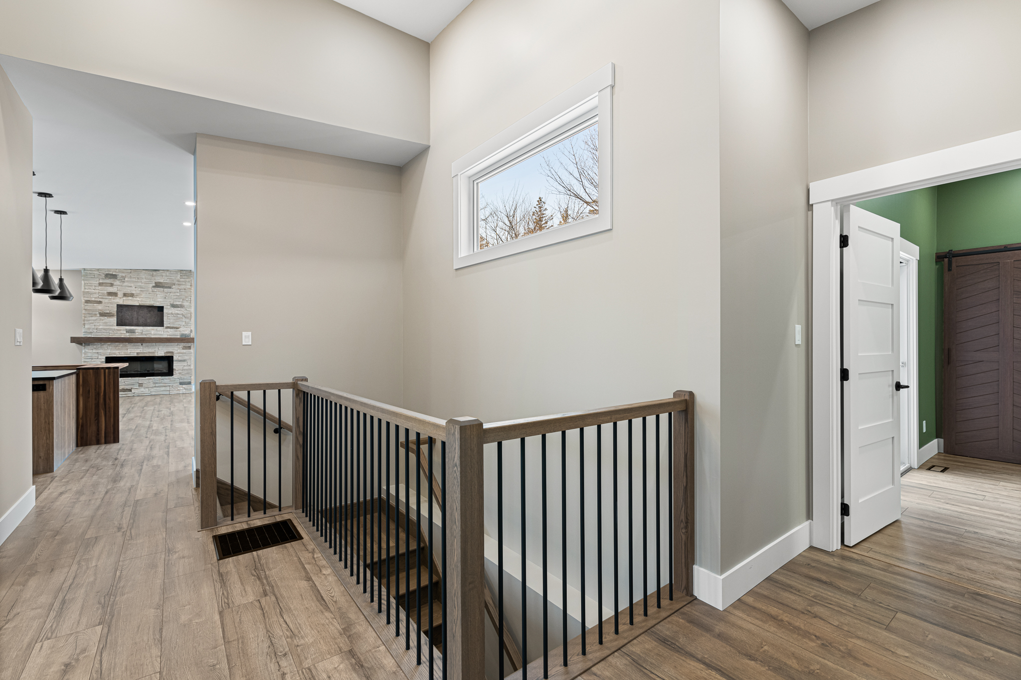 Hardwood stairs, modern railing, interior doors, trim work, base board.