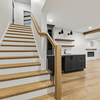Hardwood stairs, continous railing, beams, shiplap fireplace, fireplace mantel, baseboard.